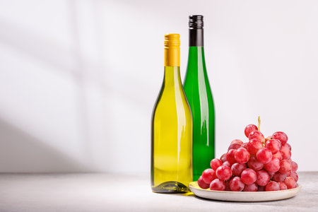 A delectable arrangement of various wine and grapes, creating an elegant display for a gourmet dining experienceの写真素材