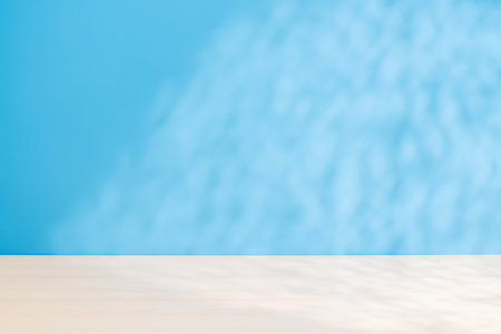 Template with empty table and wall with natural shadow and sunny glare, perfect for product presentation and mockupの写真素材