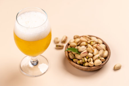 Fresh pistachios, showing their vibrant green color and unique texture, perfect for snacking or garnishing dishes paired with beerの写真素材