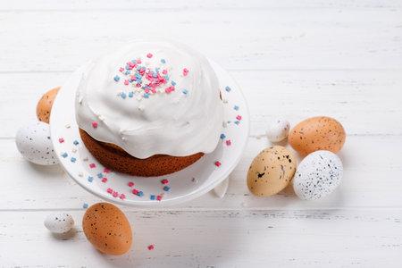 Traditional Easter cake decorated with colorful icing and sprinkles, symbolizing the festive spirit....