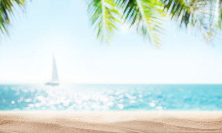 A serene seaside view with soft-focus palm leaves in the foreground and a sailboat gently gliding on the horizon under the warm sunlightの写真素材