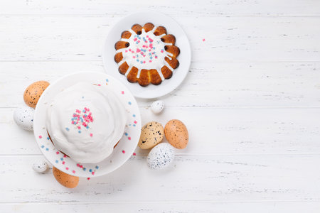 Traditional Easter cake decorated with colorful icing and sprinkles, symbolizing the festive spirit. Perfect for Easter celebrations, brunches, or as a centerpiece for the holiday tableの写真素材
