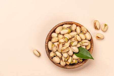 Fresh pistachios, showing their vibrant green color and unique texture, perfect for snacking or garnishing dishesの写真素材