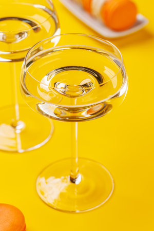 A luxurious pairing of champagne and delicate macaroons, creating an elegant and indulgent treat. Perfect for celebrations, special occasions, and gourmet experiencesの写真素材