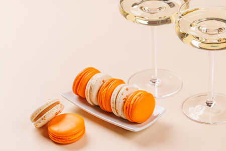 A luxurious pairing of champagne and delicate macaroons, creating an elegant and indulgent treat. Perfect for celebrations, special occasions, and gourmet experiencesの写真素材