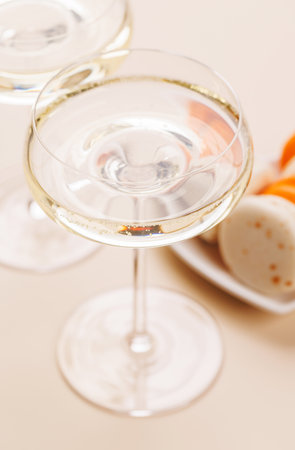 A luxurious pairing of champagne and delicate macaroons, creating an elegant and indulgent treat. Perfect for celebrations, special occasions, and gourmet experiencesの写真素材
