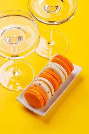 A luxurious pairing of champagne and delicate macaroons, creating an elegant and indulgent treat. Perfect for celebrations, special occasions, and gourmet experiencesの写真素材