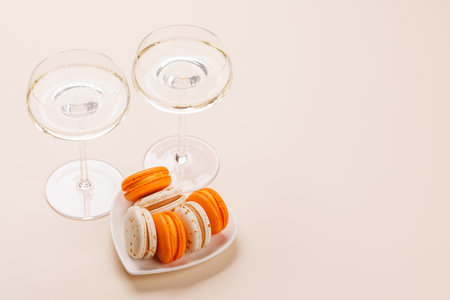 A luxurious pairing of champagne and delicate macaroons, creating an elegant and indulgent treat. Perfect for celebrations, special occasions, and gourmet experiencesの写真素材
