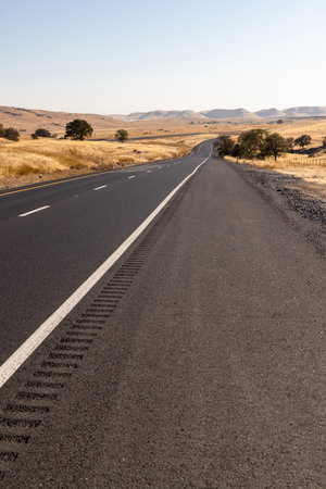 Asphalt road and countryside landscape of United States