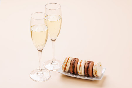 A luxurious pairing of champagne and delicate macaroons, creating an elegant and indulgent treat. Perfect for celebrations, special occasions, and gourmet experiencesの写真素材
