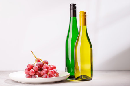 A delectable arrangement of various wine and grapes, creating an elegant display for a gourmet dining experienceの写真素材