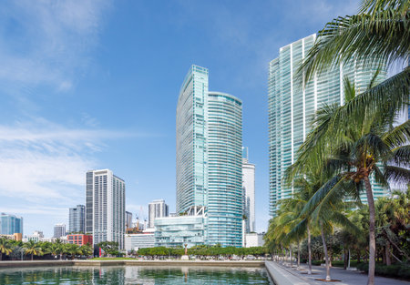 Modern skyline of Miami with towering skyscrapers, tropical vibe, and waterfront views under a sunny skyの写真素材