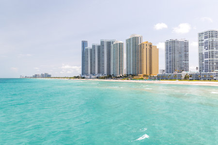 Modern skyline of Miami with towering skyscrapers, tropical vibe, and waterfront views under a sunny skyの写真素材