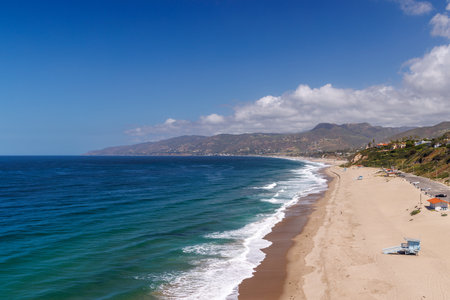 Ocean coastline in a Los Angeles with sandy beach, waves and sunny skyの写真素材