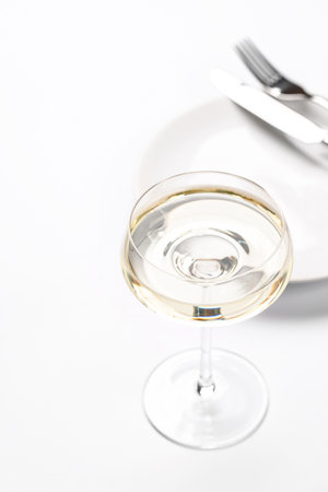 A sparkling glass of wine, effervescent and elegant, perfect for celebrations, toasts, and special occasions. The golden bubbles rise beautifully, embodying luxury and festivityの写真素材