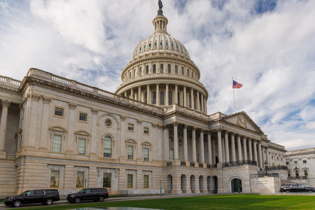 The iconic United States Capitol building, an emblem of American democracy, standing tall with its grand dome and neoclassical architectureの写真素材