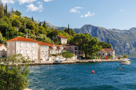 Cozy coastal town in Montenegro with traditional houses and scenic sea viewの写真素材