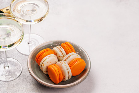 A luxurious pairing of champagne and delicate macaroons, creating an elegant and indulgent treat. Perfect for celebrations, special occasions, and gourmet experiencesの写真素材