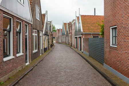 Quiet streets of a Dutch village, charming rural scene with old houses and calm atmosphereの写真素材