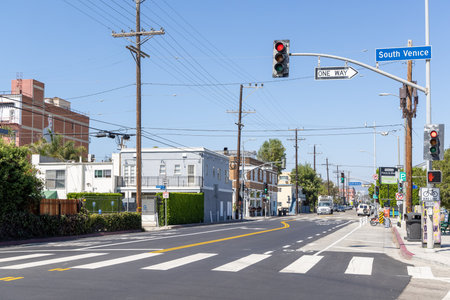 Los Angeles, California, United States - September 28 2022: A street in the Venice Beach area with typical coastal architecture, palm trees and everyday city life in this famous Los Angeles neighborhood.のeditorial素材