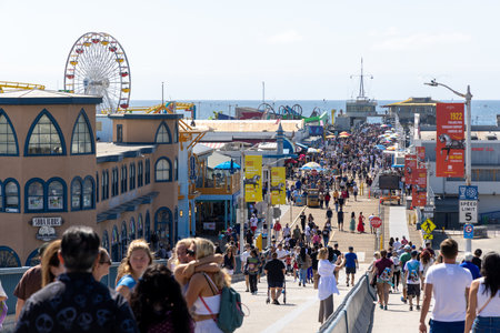 Santa Monica, California, United States - October 01 2022: Santa Monica Pier with its iconic Ferris wheel, amusement park and ocean view, a popular landmark on the Pacific coast.のeditorial素材