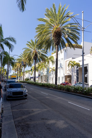 Beverly Hills, California, United States - October 01 2022: View of Rodeo Drive with luxury boutiques, palm trees and traffic, showing one of the most famous shopping streets in Los Angeles.のeditorial素材