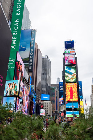 New York City, New York, United States - October 13 2022: Times Square area with bright billboards, crowds of people and heavy traffic, showing the vibrant atmosphere of one of the most famous places in New Yorkのeditorial素材