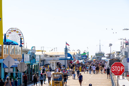 Santa Monica, California, United States - October 01 2022: Santa Monica Pier with its iconic Ferris wheel, amusement park and ocean view, a popular landmark on the Pacific coast.のeditorial素材