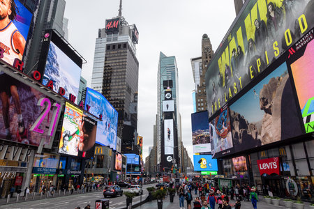 New York City, New York, United States - October 13 2022: Times Square area with bright billboards, crowds of people and heavy traffic, showing the vibrant atmosphere of one of the most famous places in New Yorkのeditorial素材