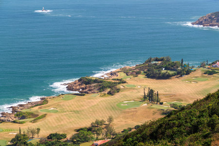 Scenic panorama from a mountain overlooking the coast and sea, with wide open viewの写真素材