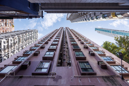 High-rise residential apartment buildings in Hong Kong, dense urban living and modern city...