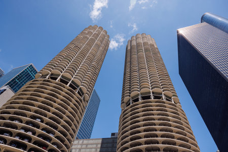 Vibrant sunny view of Chicago downtown skyline under a blue sky, highlighting the city iconic architecture and urban energyの写真素材