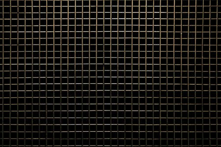metal lattice with cells on black backgroundの写真素材