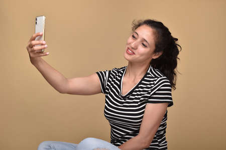 Young woman taking selfie