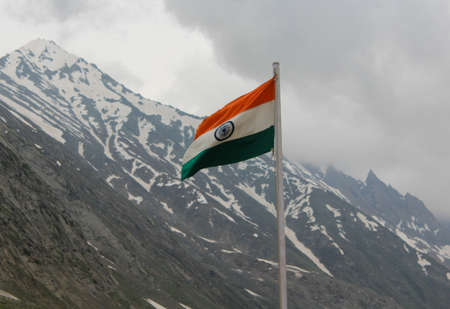 Indian flag in kashmir with beautiful snowy mountain background