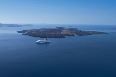 Santorini island and the volcanic isle at Greeceの写真素材