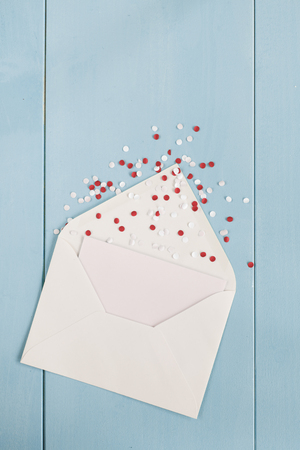 White envelope with party confettiの写真素材