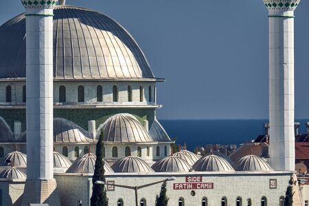 Side, Turkey - July 7, 2017: Turkish flag with Mosque in turkish city Side on the blue sky...