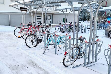Bicycle parking area in winter near the school.の写真素材