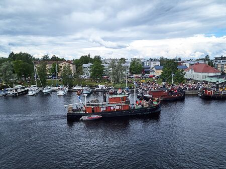 Joensuu, Finland - July 6, 2019: Traditional retro steamships regatta on the Pielisjoki river.のeditorial素材