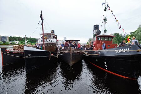 Joensuu, Finland - July 6, 2019: Traditional retro steamships regatta on the Pielisjoki river.のeditorial素材