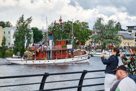 Joensuu, Finland - July 6, 2019: Traditional retro steamships regatta on the Pielisjoki river.のeditorial素材