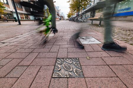 Joensuu, Finland - October 3, 2019: Street Kauppakatu in downtown with small art works.のeditorial素材