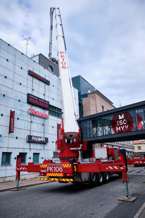 Joensuu, Finland - 8 September 2019: Firetruck with ladder extended, near the shopping mall.