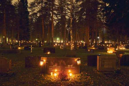Joensuu, Finland - November 4, 2018: Many candles kindling at a cemetery on All Saints' Dayのeditorial素材