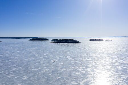 Ice covered lake in spring on a sunny day