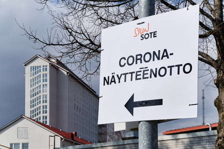 Joensuu, Finland - April 19, 2020: Road sign to Coronavirus sampling in Siun Sote Public health department in the Finnish language "Corona-naytteenotto"のeditorial素材