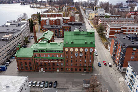 Kuopio, Finland - April 28, 2020: Aerial view of the rebuilt old building of mill to the modern apartment building. Oy Gust Ranin old mill.のeditorial素材
