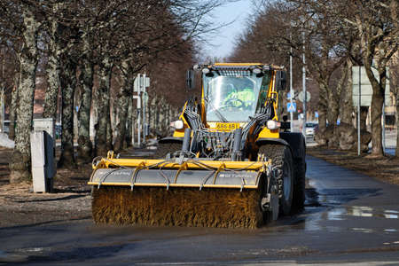 Joensuu, Finland - March 27, 2020: Street cleaning vehicle in spring.