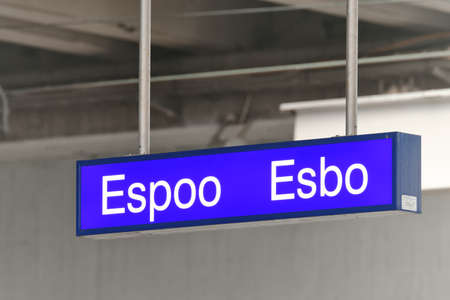 Finland, Espoo - November 10, 2020: Espoo city signboard on the railway station, Finland.のeditorial素材